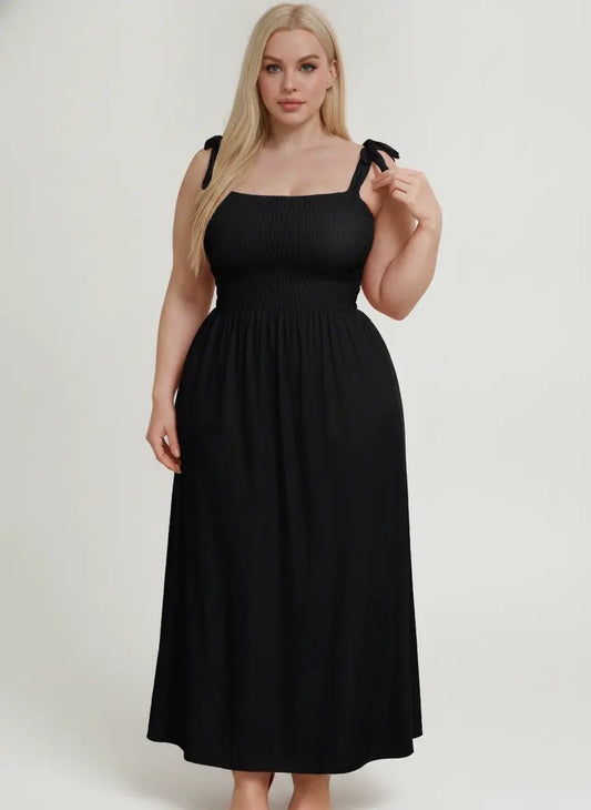 Black Vaura nightdress displayed on a plain background, featuring a comfortable, stylish sleepwear design.