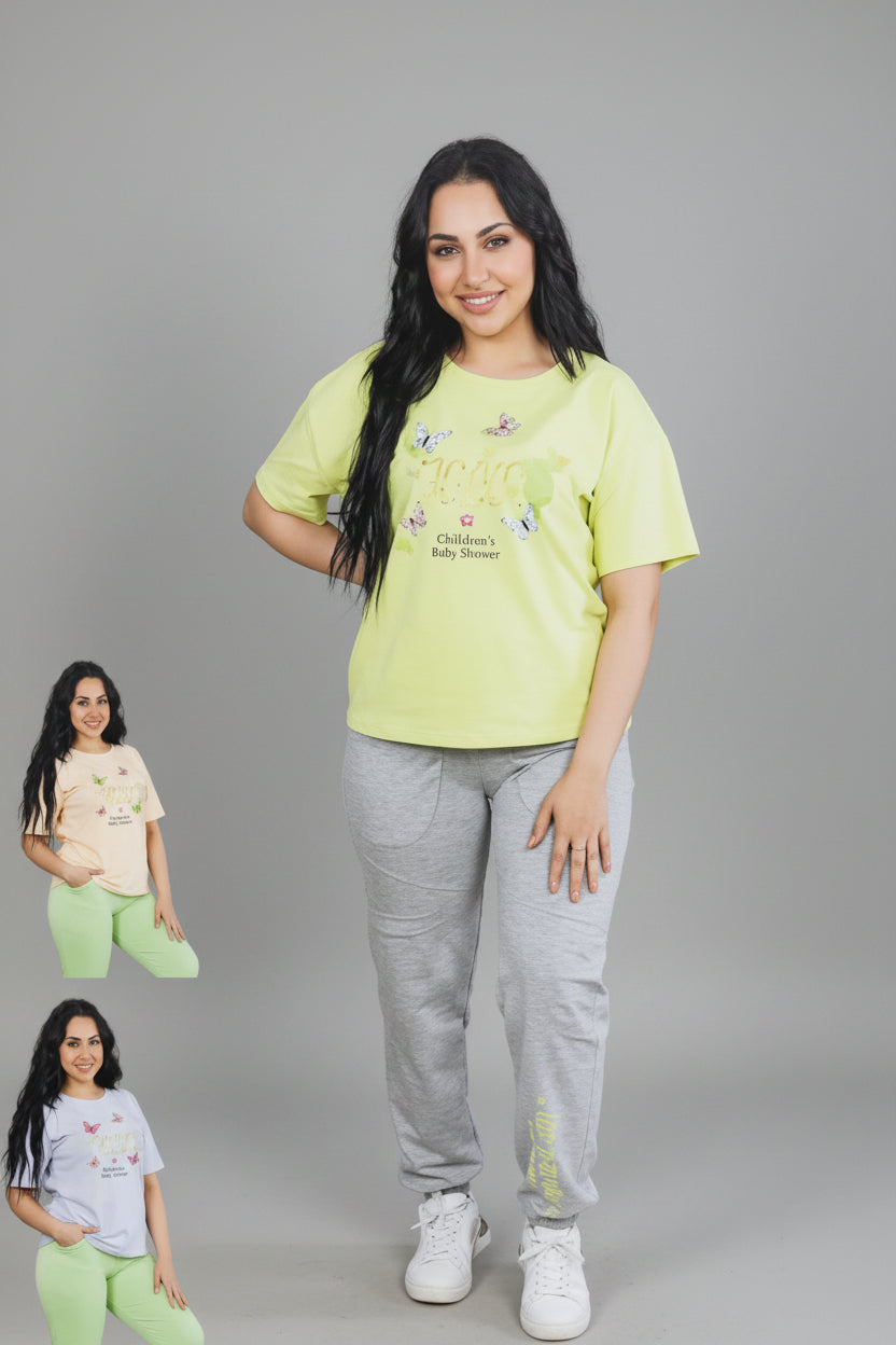 Woman wearing a bright yellow t-shirt and gray pants in a living room setting with 'SA Swing' branding.