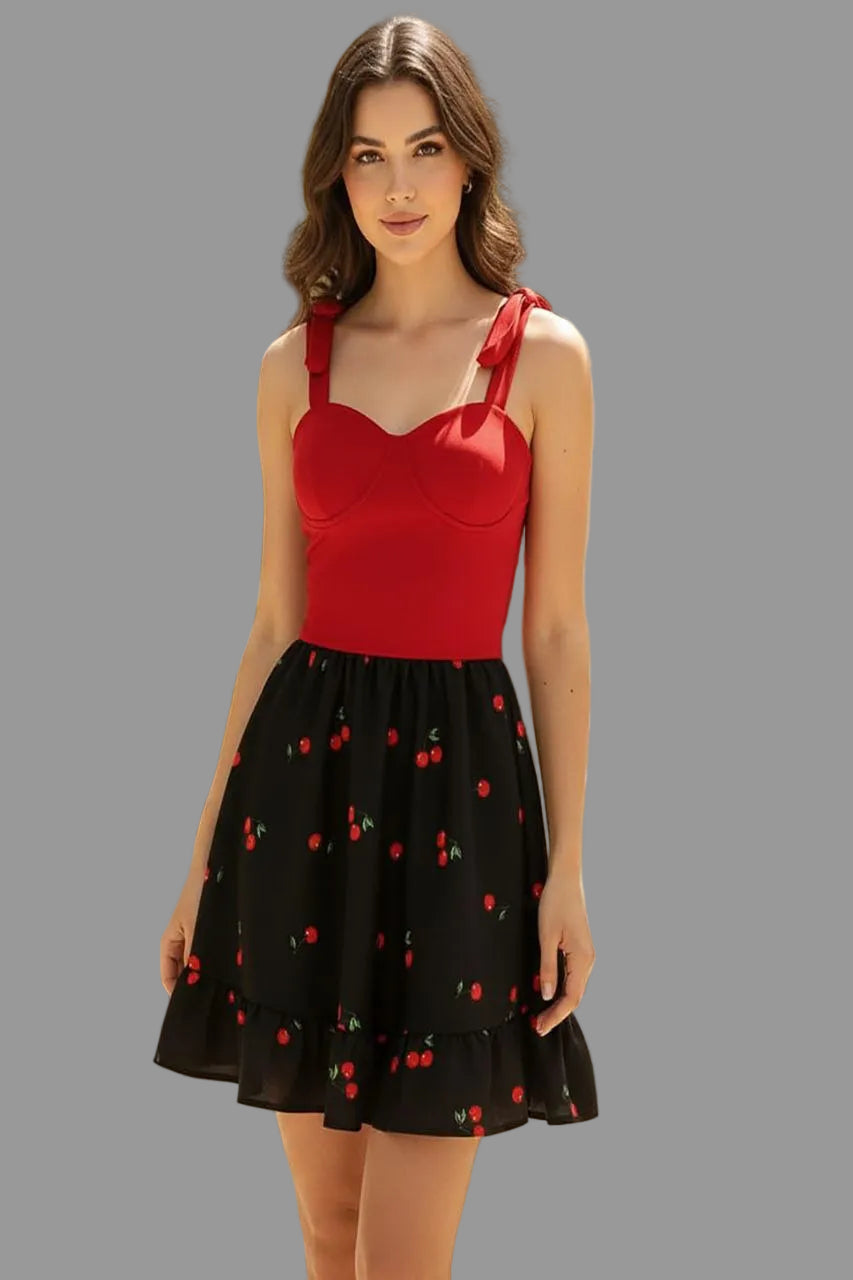 Red and black cherry print dress with spaghetti straps from Vaura, featuring a stylish tie strap design.