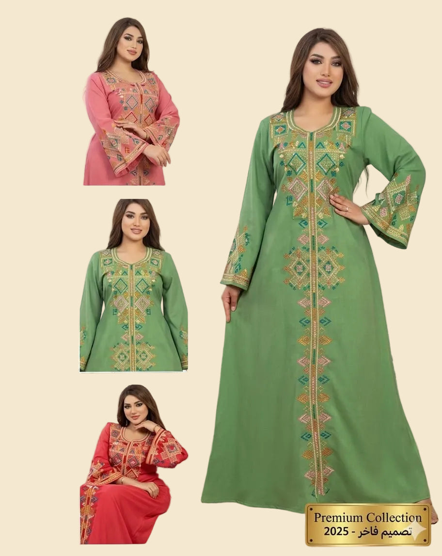 Green embroidered dress with 'VAURA' branding on a white background